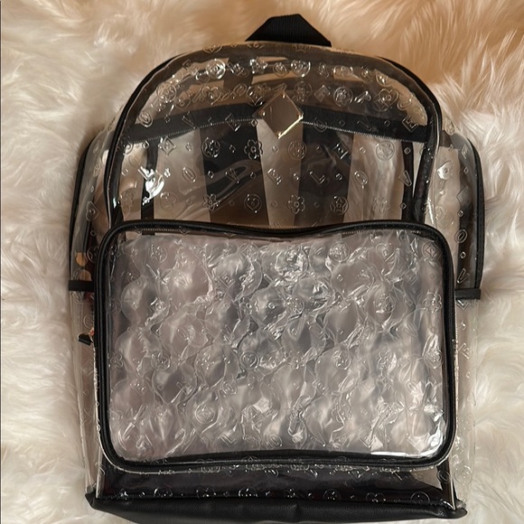 clear backpack with leather trim Jon Hart Made of PVC material Measures approximately 9.5 x 11.5 x 5 Features exterior front pocket mommore Clear Backpack Heavy Duty